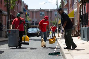 BMCCP members sweeping and cleaning neighborhoods
